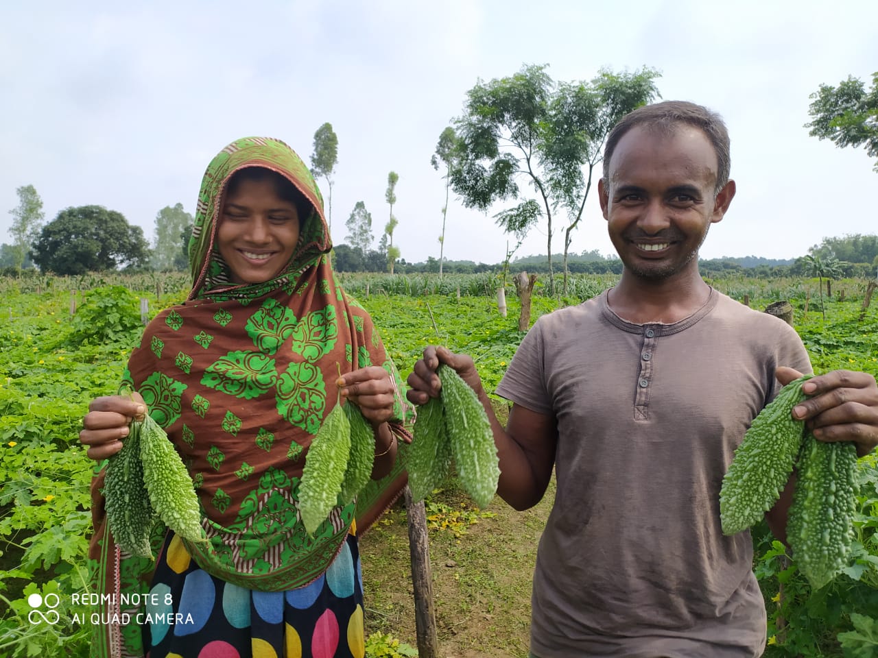 Happy farmers in Bangladesh with lalteer